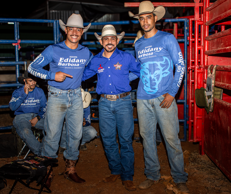 Three cowboys posing at a rodeo event in Tiros, Minas Gerais, Brazil.