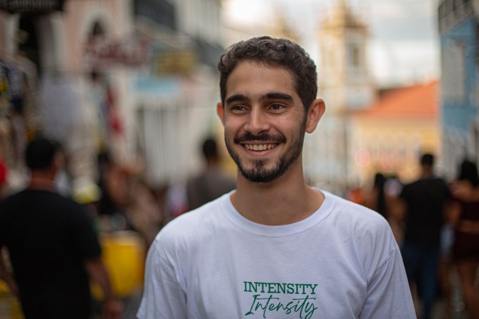 Portrait of a smiling man in Salvador, Brazil's vibrant street setting, Bahia.