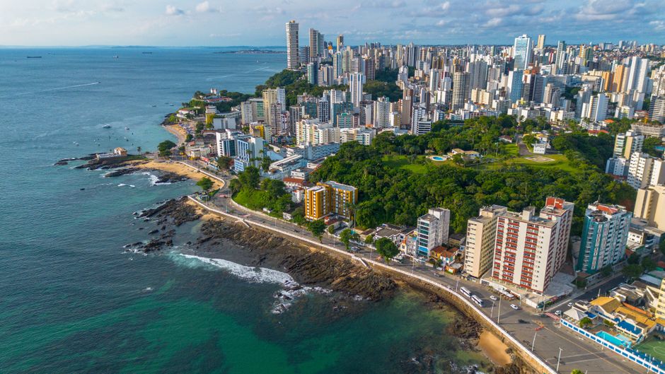 A stunning aerial view of the modern cityscape and coastline of Salvador, Bahia, Brazil.